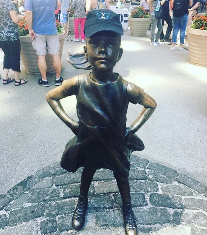 The Fearless Girl statue  in NYC wearing a VTM Foundation hat, July 2017